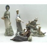 Four ceramic figures, including two Nao figures,