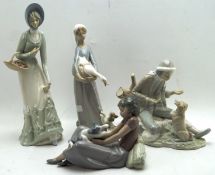 Four ceramic figures, including two Nao figures,