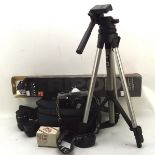 A Praktica camera and lens with a Miranda tripod,