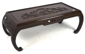 A Chinese coffee table on outward carved legs,