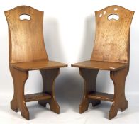 A pair of 20th century wooden chairs,