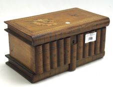 A marquetry inlaid wood box with hinged lid in the form of a pile of books,