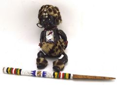 An unusual vintage child's doll, dressed in African tribal clothing,