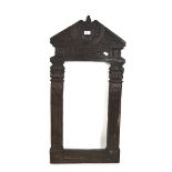 A heavy carved wood frame,