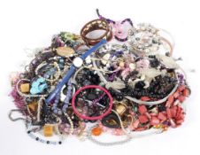 A collection of costume jewellery, including necklaces, rings, brooches, assorted rings,