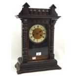 An early 20th century stained mahogany cased mantle clock,