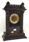 An early 20th century stained mahogany cased mantle clock,