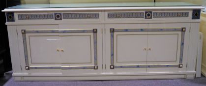 A large cream sideboard with two long drawers over two cupboards,