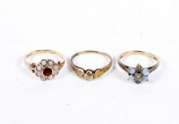 Three 9ct gold rings, including two cluster rings, one set with opals surrounding a garnet,