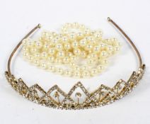 A ladies wedding tiara and a string of pearls,