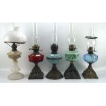 Five late 19th-early 20th century oil lamps,