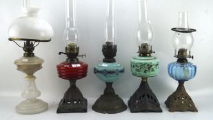 Five late 19th-early 20th century oil lamps,