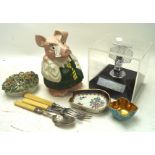 An assortment of collectables, including a Natwest pig,