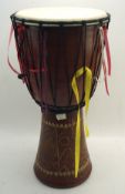 A wooden African hand drum,