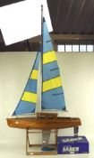 A large remote controlled pond yacht,