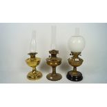 Three Victorian brass oil lamps,