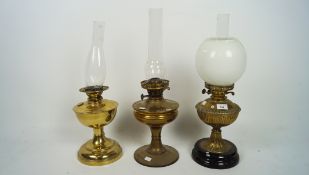 Three Victorian brass oil lamps,