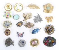 A selection of twenty vintage brooches, of assorted designs, some floral ceramic examples,