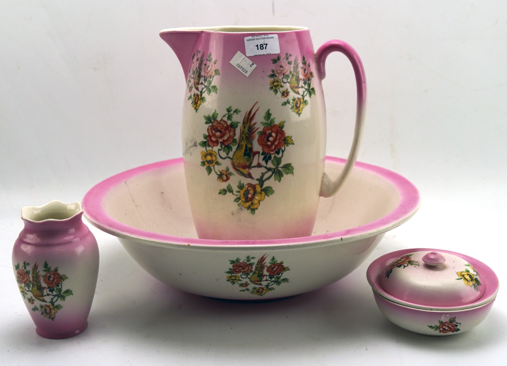 A jug and basin wash set with matching vase and lidded soap dish,