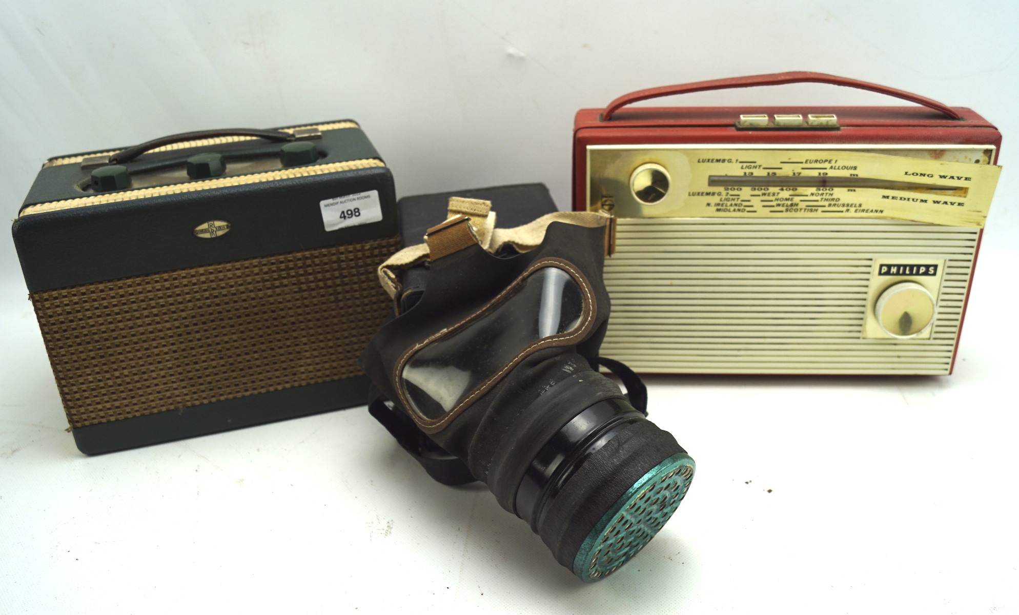 Two vintage radios and a gas mask,