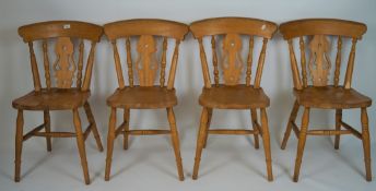 Four fiddleback kitchen chairs, on turned supports,