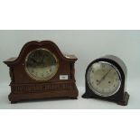 Two vintage mantle clocks, one with silvered face featuring Arabic numerals, marked Smiths Enfield,