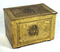 A large brass clad wooden coal box with repousse decoration