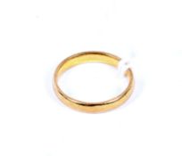 A 22ct yellow gold wedding band,