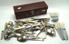 An assortment of flatware in a leather box,