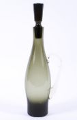 A vintage 1960s smoked grey/green glass decanter and stopper, of slender oviform,