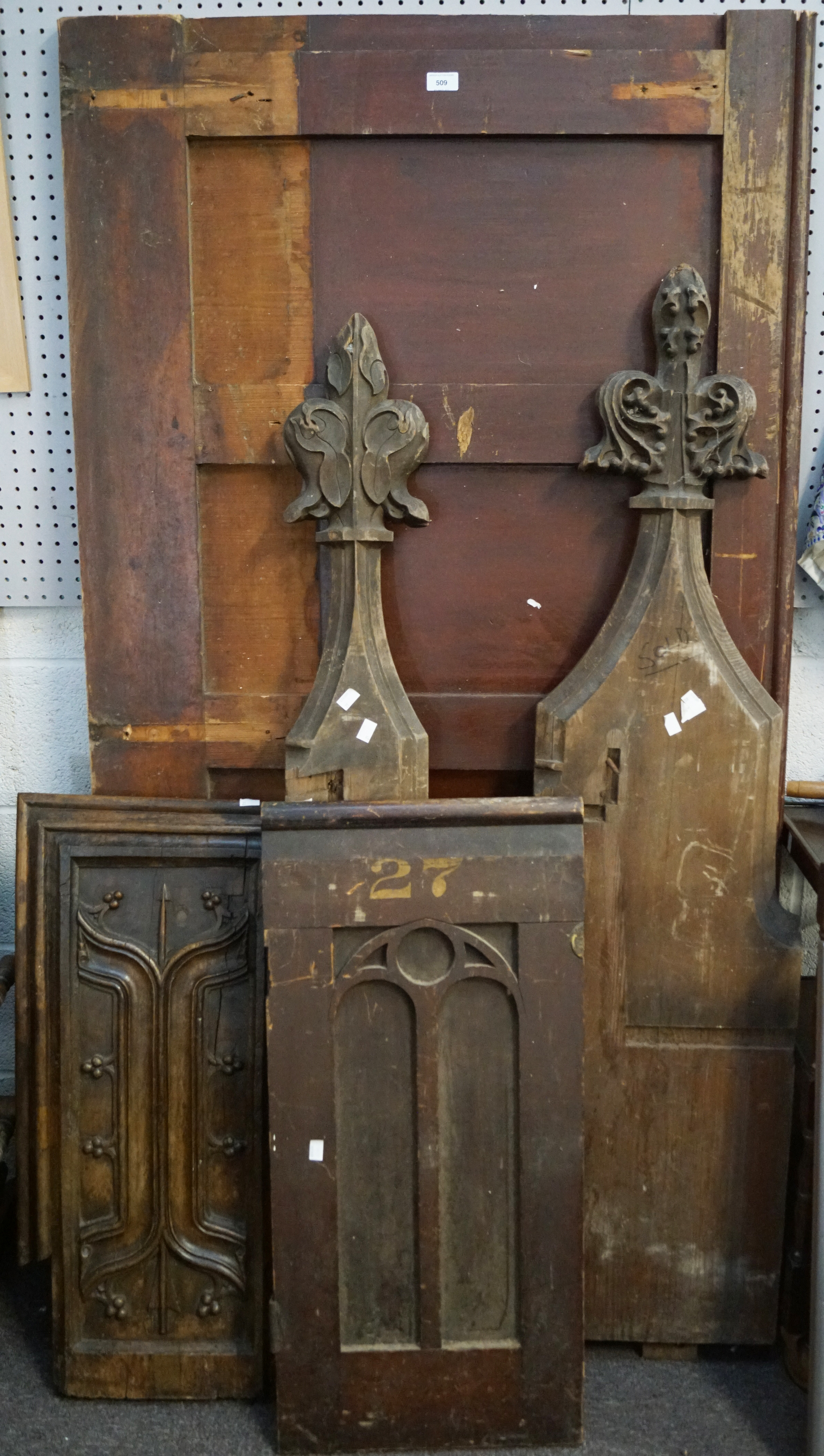 A dismantled church pew of various woods,