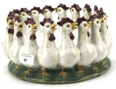 A 20th century ceramic dish modelled as interlocked chickens,