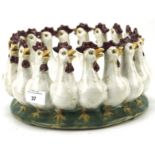 A 20th century ceramic dish modelled as interlocked chickens,