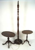 Two mahogany low side tables and a standard lamp,