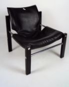 A 1970's Arkana Safari chair by maurice Burke having wooded legs,