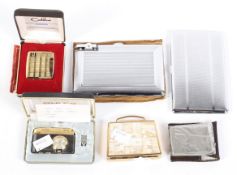A selection of lighters and cigarette cases,