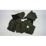 A selection of assorted military related clothes,