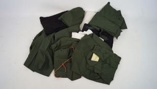 A selection of assorted military related clothes,