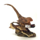 A Beswick model of a pheasant, in a naturalistic pose,