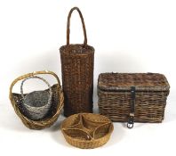 A group of six vintage and modern wicker baskets, one in hamper form,