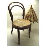 A child's bentwood cafe chair and a parasol,