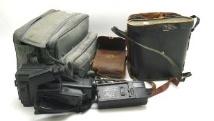 A selection of binoculars and cameras,