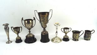 A variety of silver plated ware, including animal related trophies,