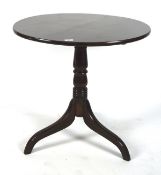 Early 20th century mahogany tilt top wine table, of circular form, on turned column and tripod base,