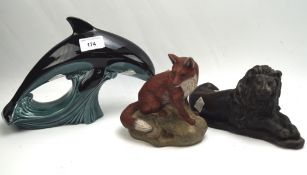 Two Poole pottery animals and a resin sculpture of a lion,