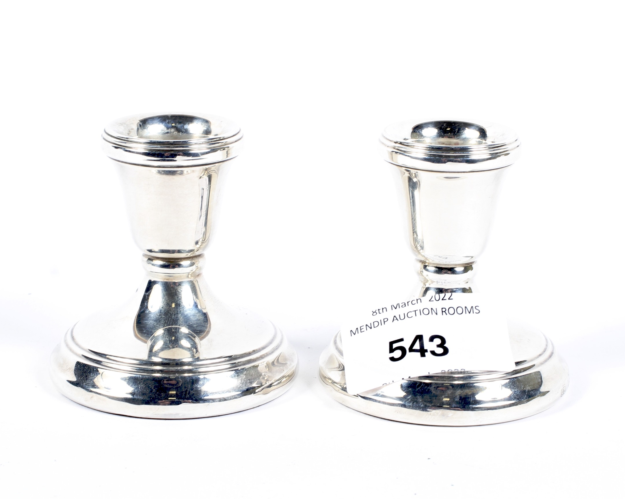 A pair of contemporary squat silver candlesticks, each hallmarked Birmingham 1990,