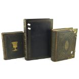 Three antique leather bound bibles and religious works,