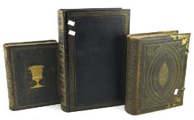 Three antique leather bound bibles and religious works,