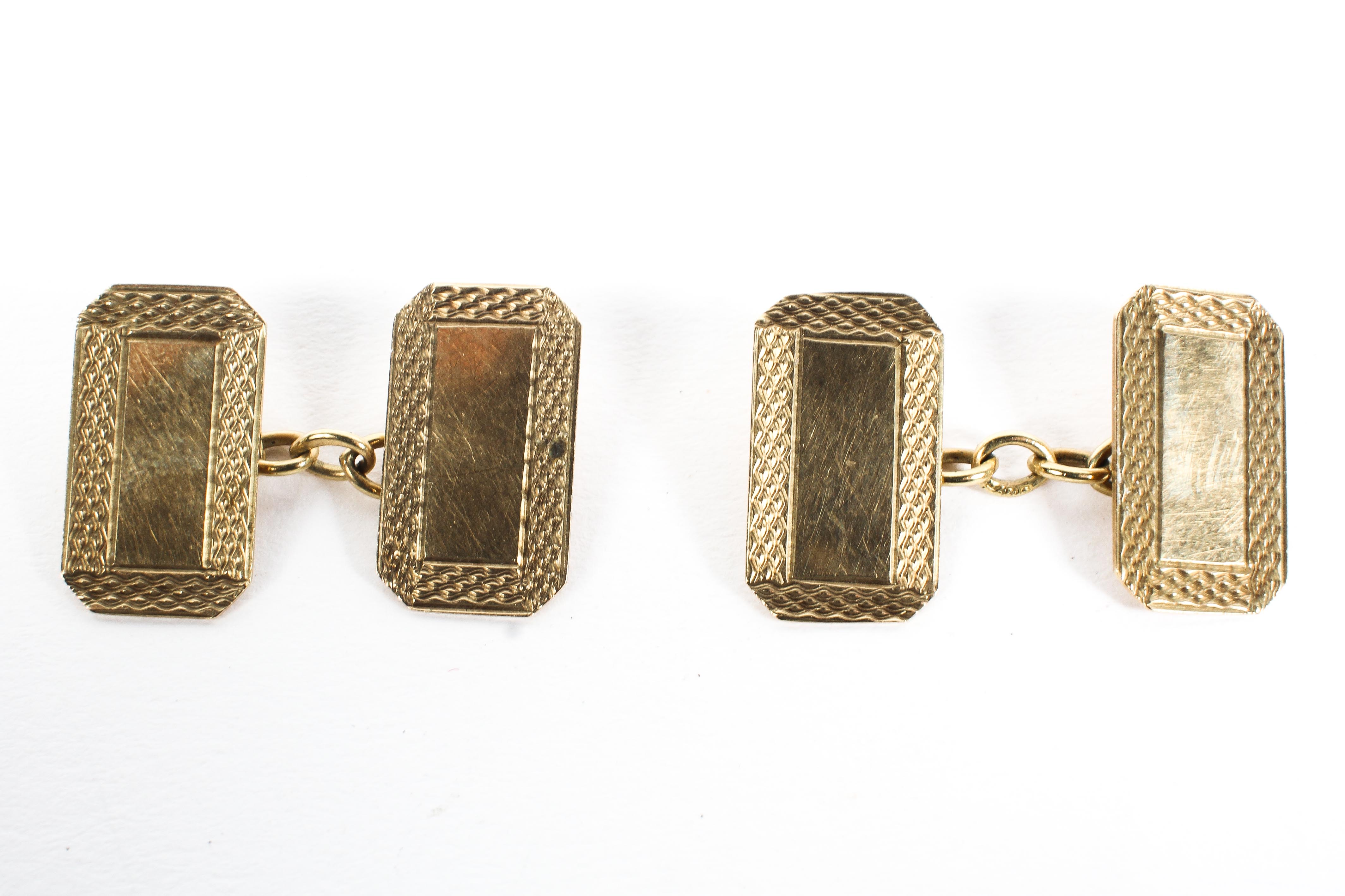 A pair of 9ct gold cufflinks, with engine turned decoration, in original box,