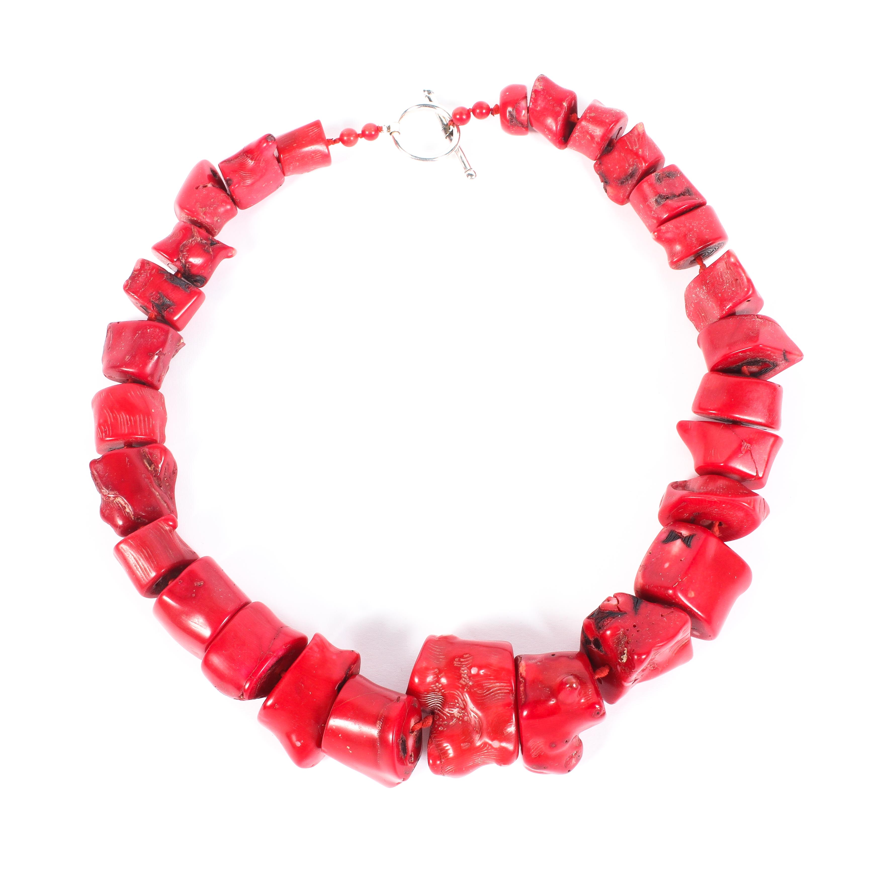 A large early 20th century red coral necklace with T bar and eye catch, 115cm,
